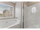 Bathroom with shower and garden tub at 5851 Brookfield Pointe Dr, Charlotte, NC 28216