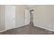 Bright bedroom with carpet, closet, and access to another room at 5851 Brookfield Pointe Dr, Charlotte, NC 28216