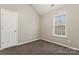 Charming bedroom with a closet and window, carpeted floor at 5851 Brookfield Pointe Dr, Charlotte, NC 28216