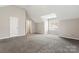 Large bedroom with vaulted ceiling and carpet at 5851 Brookfield Pointe Dr, Charlotte, NC 28216