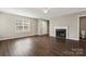 Living room featuring a fireplace and dark laminate floors at 5851 Brookfield Pointe Dr, Charlotte, NC 28216