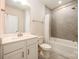 Well-lit bathroom featuring a shower-tub combo and a vanity with white cabinets at 604 Amalfi Dr, Davidson, NC 28036