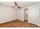 Bedroom with hardwood floors, ceiling fan, and ensuite bathroom at 604 Amalfi Dr, Davidson, NC 28036