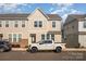 Charming two-story home featuring a white pickup truck in the driveway and a neatly maintained front yard at 604 Amalfi Dr, Davidson, NC 28036