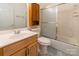 Clean bathroom with wood vanity, a shower/tub, and an overhead cabinet at 606 Elmhurst Dr, Fort Mill, SC 29715