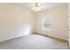 Well-lit bedroom with neutral walls, carpet, and ceiling fan at 606 Elmhurst Dr, Fort Mill, SC 29715