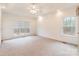 Bright and airy bedroom with neutral carpeting and ceiling fan at 606 Elmhurst Dr, Fort Mill, SC 29715