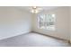 Bedroom featuring neutral decor, carpet, and a large window at 606 Elmhurst Dr, Fort Mill, SC 29715