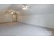 Large bonus room featuring carpet, ceiling fans, and an attic access at 606 Elmhurst Dr, Fort Mill, SC 29715