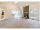 Spacious living room with stone fireplace and high ceilings at 606 Elmhurst Dr, Fort Mill, SC 29715