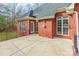 Brick patio with access from the house and a view of the backyard at 606 Elmhurst Dr, Fort Mill, SC 29715