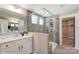 Modern bathroom with large walk-in shower and double vanity at 6911 Fauna Dr # 60, Charlotte, NC 28215