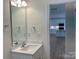 Bathroom with a vanity, mirror and a view of the kitchen at 6911 Fauna Dr # 60, Charlotte, NC 28215