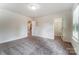 Bright bedroom featuring neutral carpeting, natural light, and a large walk-in closet at 6911 Fauna Dr # 60, Charlotte, NC 28215