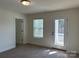 Bright bedroom with access to a private balcony or porch at 6911 Fauna Dr # 60, Charlotte, NC 28215