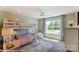 Charming bedroom with a bunk bed and large window at 6911 Fauna Dr # 60, Charlotte, NC 28215