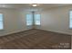 Spacious bedroom with neutral carpeting and multiple windows at 6911 Fauna Dr # 60, Charlotte, NC 28215