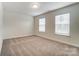 Empty bedroom featuring neutral carpeting and natural light at 6911 Fauna Dr # 60, Charlotte, NC 28215