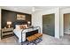 Bright bedroom with a metal bed frame and double doors at 6911 Fauna Dr # 60, Charlotte, NC 28215