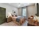 Bedroom with a queen-size bed, nightstands, and a desk at 6911 Fauna Dr # 60, Charlotte, NC 28215