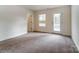 Clean empty bedroom featuring neutral carpeting and natural light at 6911 Fauna Dr # 60, Charlotte, NC 28215