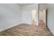 Empty bedroom with wood floors showing views to the bathroom and multiple doorways at 6911 Fauna Dr # 60, Charlotte, NC 28215