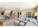 Spacious bonus room with L-shaped sofa and stairs at 6911 Fauna Dr # 60, Charlotte, NC 28215