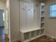 White entryway with bench seating, cubbies and hooks at 6911 Fauna Dr # 60, Charlotte, NC 28215