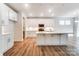 Well-lit kitchen with white cabinetry, stainless steel appliances, and an eat-in island at 6911 Fauna Dr # 60, Charlotte, NC 28215