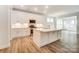 Bright kitchen with white cabinets, stainless appliances, and an island at 6911 Fauna Dr # 60, Charlotte, NC 28215