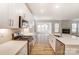 Spacious kitchen featuring stainless steel appliances, white cabinets, and an island with a sink and faucet at 6911 Fauna Dr # 60, Charlotte, NC 28215