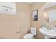 Clean powder room with a pedestal sink and toilet at 7405 Bosson Sw St, Concord, NC 28025