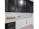 Laundry room with dark cabinets and granite countertop at 7405 Bosson Sw St, Concord, NC 28025