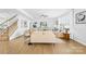 Light-filled living room with hardwood floors and comfortable seating at 7405 Bosson Sw St, Concord, NC 28025