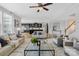 Spacious living room with hardwood floors and a view into the kitchen at 7405 Bosson Sw St, Concord, NC 28025