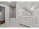 Bathroom with a white vanity, quartz countertop and tiled shower at 835 Museum Dr, Charlotte, NC 28207