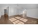 Large bedroom with hardwood floors and multiple windows at 835 Museum Dr, Charlotte, NC 28207