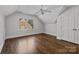 Bright bedroom with hardwood floors, double door closet, and large windows at 835 Museum Dr, Charlotte, NC 28207