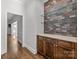 Butlers pantry with dark wood cabinets, glass shelves and marble countertop at 835 Museum Dr, Charlotte, NC 28207