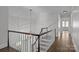 Upper hallway with hardwood floors and elegant light fixture at 835 Museum Dr, Charlotte, NC 28207