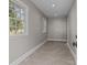 Bright laundry room with tile floors and ample natural light at 835 Museum Dr, Charlotte, NC 28207