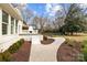 Stone patio and walkway leading to a fenced backyard at 835 Museum Dr, Charlotte, NC 28207