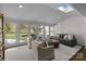 Bright sunroom with skylight and expansive windows overlooking a beautifully landscaped backyard at 835 Museum Dr, Charlotte, NC 28207