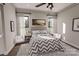 Well-lit bedroom features a chevron patterned comforter and an area rug to add warmth and texture at 000 Ridgecrest Rd # 10, Locust, NC 28097