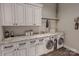 Bright laundry room features modern appliances, stylish countertops, and ample storage space at 000 Ridgecrest Rd # 10, Locust, NC 28097