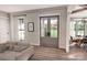 Bright living room features stylish decor, wood floors, and an open view into the dining room at 000 Ridgecrest Rd # 10, Locust, NC 28097