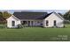 This home has a beautiful rear view, showcasing an idyllic setting for relaxation and outdoor enjoyment at 000 Ridgecrest Rd # 10, Locust, NC 28097