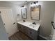 Double vanity bathroom with modern fixtures and a large mirror at 106 Gilliatt St, Shelby, NC 28150