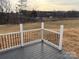 Composite deck with black metal railings, offering a peaceful backyard view at 106 Gilliatt St, Shelby, NC 28150