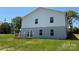 Rear view of the house showing a two-level exterior and walkout access to the backyard at 106 Gilliatt St, Shelby, NC 28150